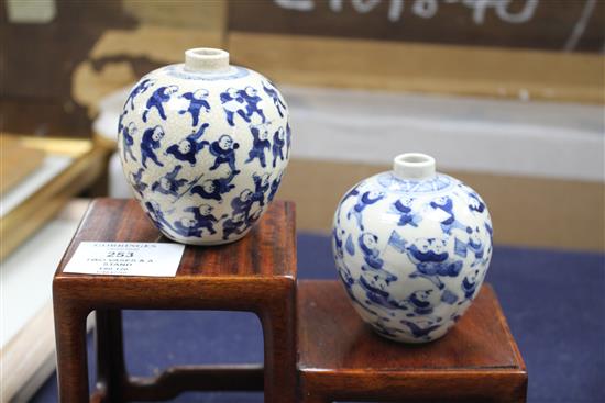 Two Chinese crackleglaze small blue and white vases, painted with figures, late 19th century plus wood scholars stand tallest 7cm